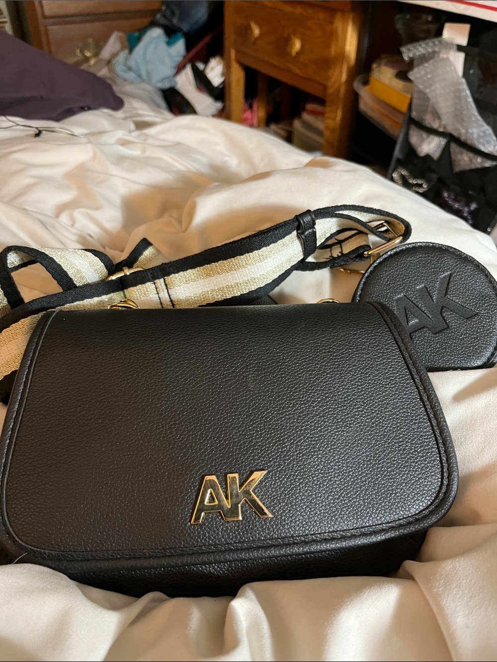Anne Klein Black Crossbody with Gold AK Emblem and Striped Strap